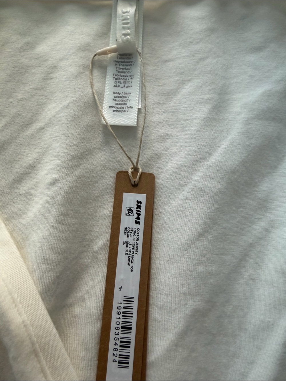 SKIMS Cream and Grey Long-Sleeve Basics with Branded Hang Tag
